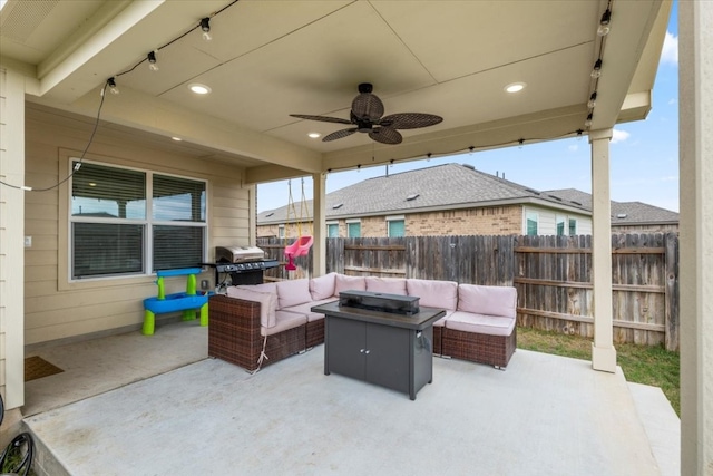 view of patio / terrace featuring a grill, an outdoor living space with a fire pit, and ceiling fan