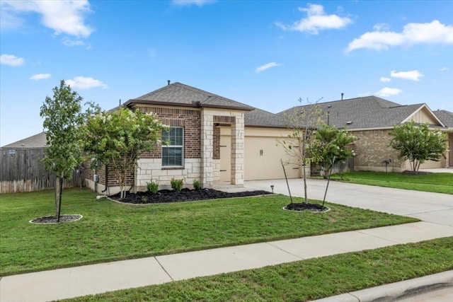 view of front of house with a garage and a front yard