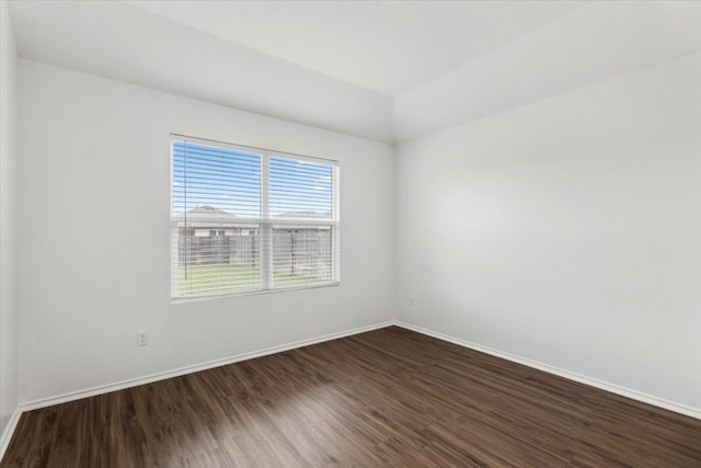 spare room with hardwood / wood-style floors