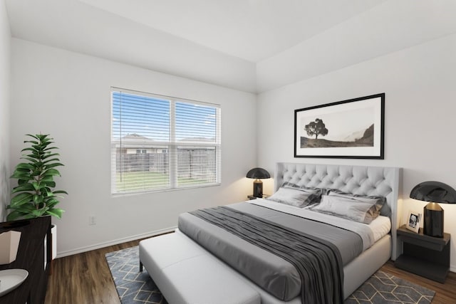 bedroom featuring dark hardwood / wood-style flooring