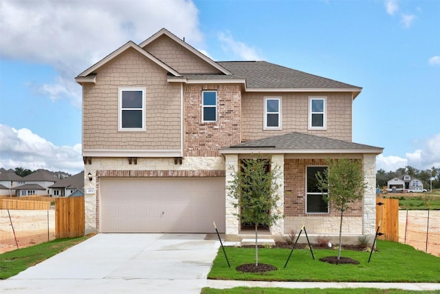 213 Skipping Stone Run, Georgetown, TX 78628 - view of front of home with an attached garage, driveway, roof with shingles, and stone siding