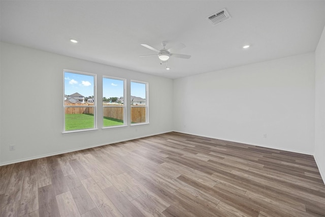 213 Skipping Stone Run, Georgetown, TX 78628 - spare room featuring a ceiling fan, wood finished floors, and recessed lighting