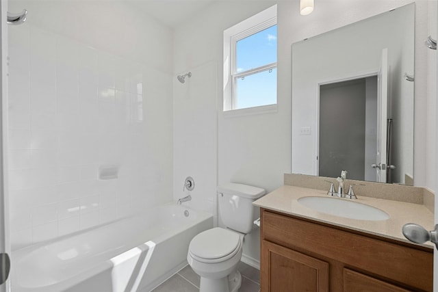 full bathroom with tile patterned floors, vanity, toilet, and tiled shower / bath