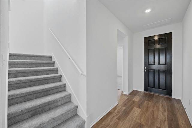 foyer entrance featuring dark hardwood / wood-style floors