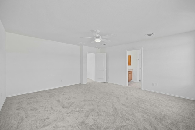 213 Skipping Stone Run, Georgetown, TX 78628 - unfurnished bedroom with light carpet, ensuite bathroom, and a ceiling fan