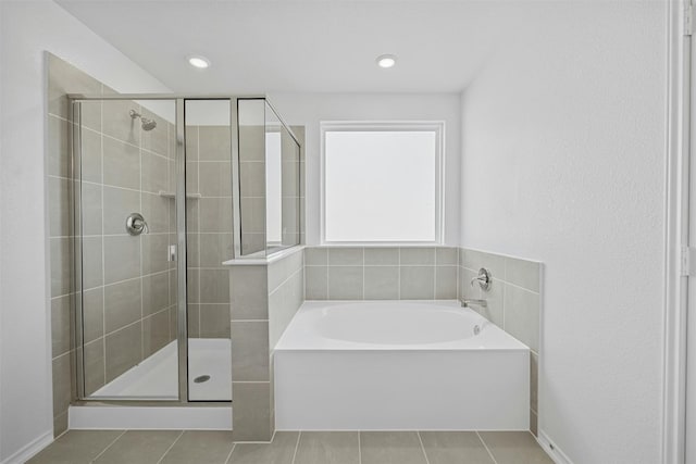 213 Skipping Stone Run, Georgetown, TX 78628 - full bathroom with tile patterned flooring, a garden tub, and a shower stall