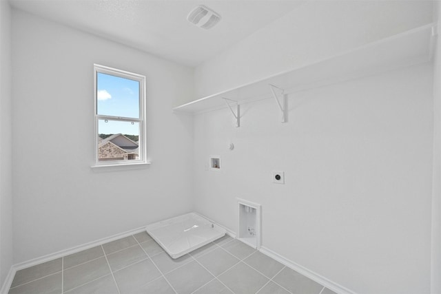 213 Skipping Stone Run, Georgetown, TX 78628 - washroom featuring hookup for a gas dryer, hookup for an electric dryer, hookup for a washing machine, and light tile patterned floors