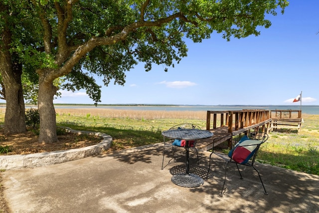 view of patio featuring a water view