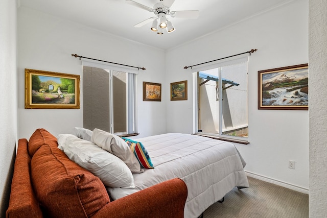 carpeted bedroom with ceiling fan and access to outside