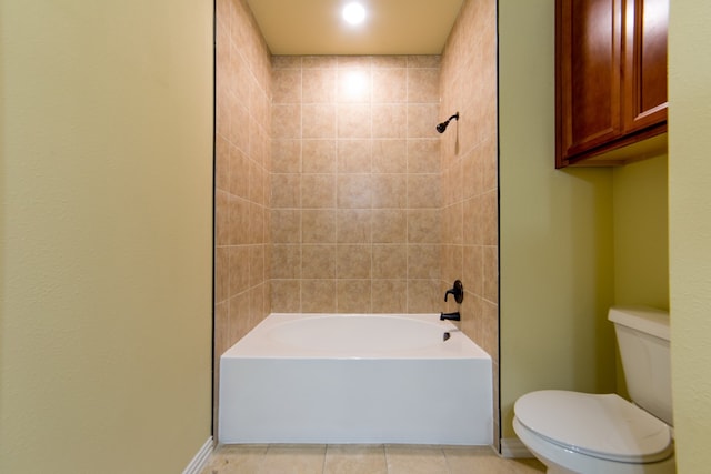 bathroom featuring toilet, shower / tub combination, and tile patterned floors