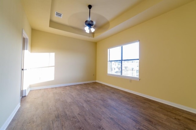 2101 Town Centre Dr Unit 1408, Round Rock, TX 78664 - spare room with wood finished floors, ceiling fan, a tray ceiling, and baseboards