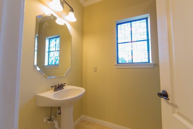 2101 Town Centre Dr Unit 1408, Round Rock, TX 78664 - bathroom with plenty of natural light, crown molding, and baseboards