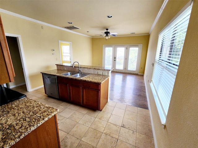 kitchen with ornamental molding, sink, an island with sink, and stainless steel dishwasher