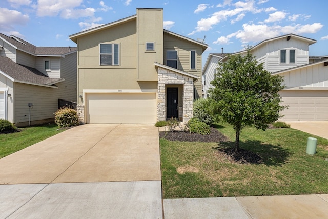 view of front of house with a front yard and a garage