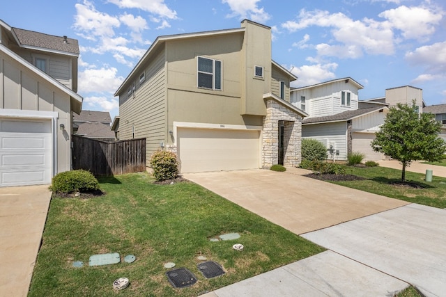 view of front facade with a garage and a front lawn