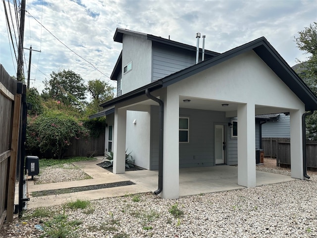 rear view of house featuring a patio area