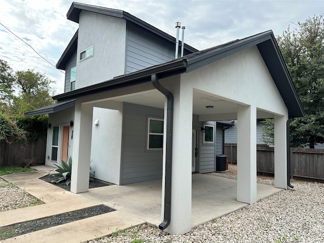 back of property with a patio