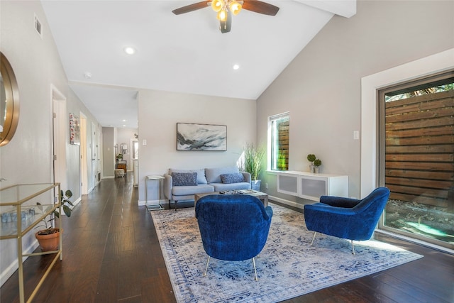 living room with dark wood-type flooring, ceiling fan, a wealth of natural light, and high vaulted ceiling