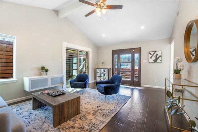 living room with plenty of natural light, ceiling fan, dark hardwood / wood-style flooring, and lofted ceiling with beams