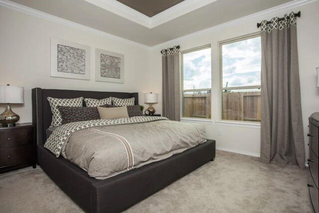 bedroom featuring light colored carpet and ornamental molding