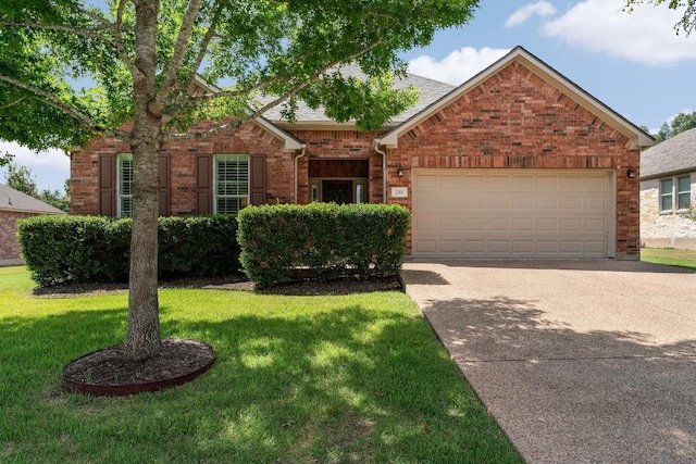 view of front of home with a garage and a front lawn