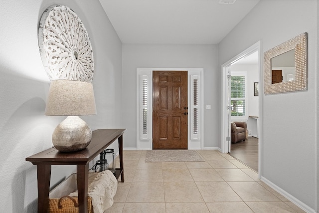 foyer featuring light tile patterned floors