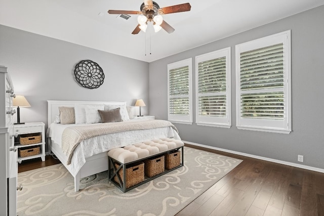 bedroom featuring ceiling fan and dark wood-type flooring