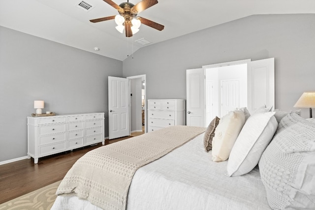 bedroom with ceiling fan, dark hardwood / wood-style floors, and lofted ceiling