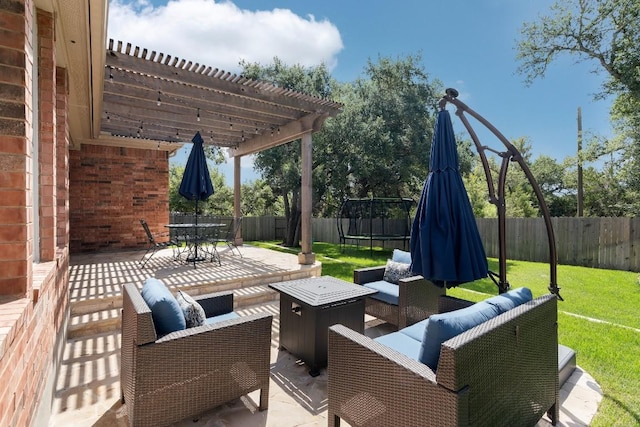 view of patio with a pergola and a trampoline