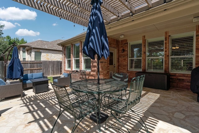 view of patio featuring outdoor lounge area and a pergola