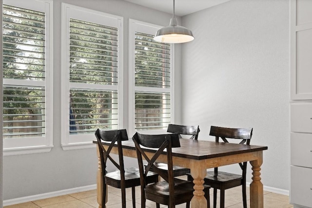 dining area featuring light tile patterned floors