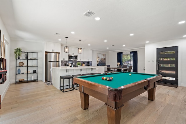 playroom with crown molding, pool table, and light wood-type flooring