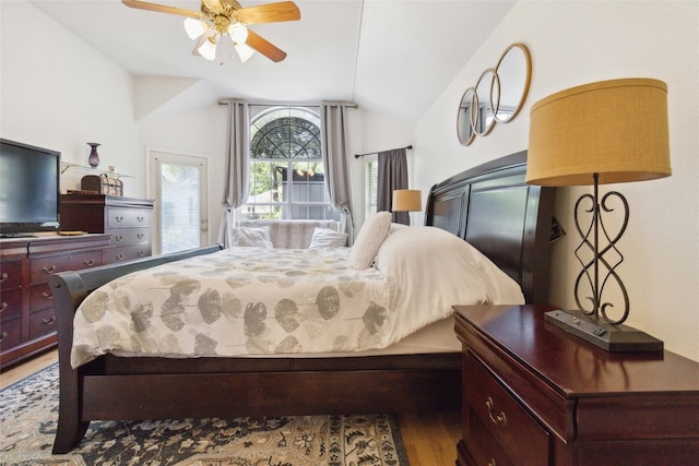 bedroom with vaulted ceiling, hardwood / wood-style flooring, and ceiling fan