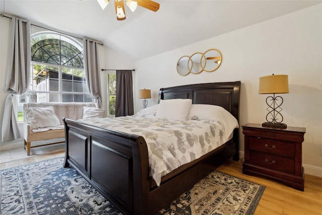 bedroom featuring ceiling fan, vaulted ceiling, and light hardwood / wood-style floors