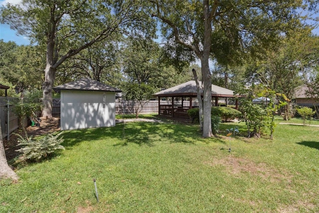 view of yard with a storage unit and a gazebo