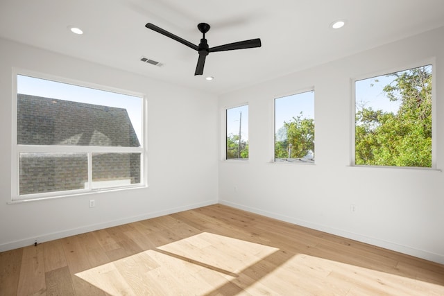 unfurnished room with light wood-type flooring and ceiling fan