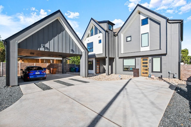 back of house with a carport