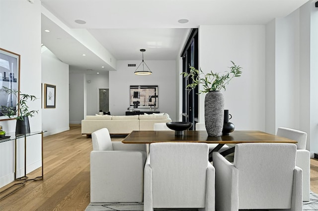 dining area with light hardwood / wood-style flooring