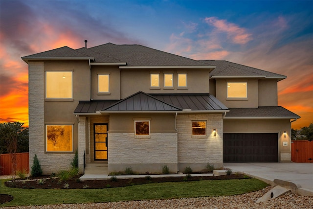 prairie-style home featuring a garage