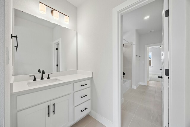 bathroom with vanity, shower / bath combination, and tile patterned flooring