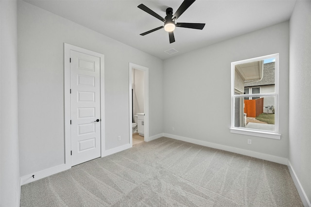 empty room featuring light carpet and ceiling fan