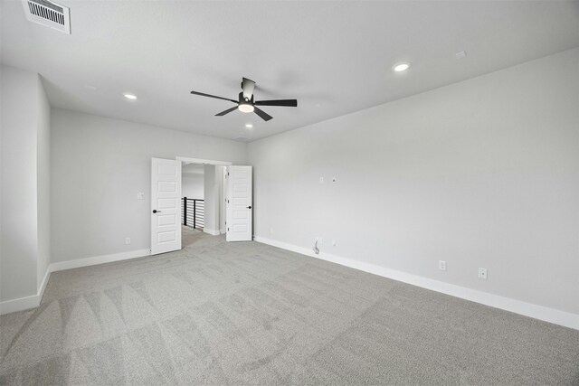 unfurnished bedroom with ceiling fan and light carpet