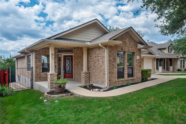 view of front of house featuring a garage and a front lawn