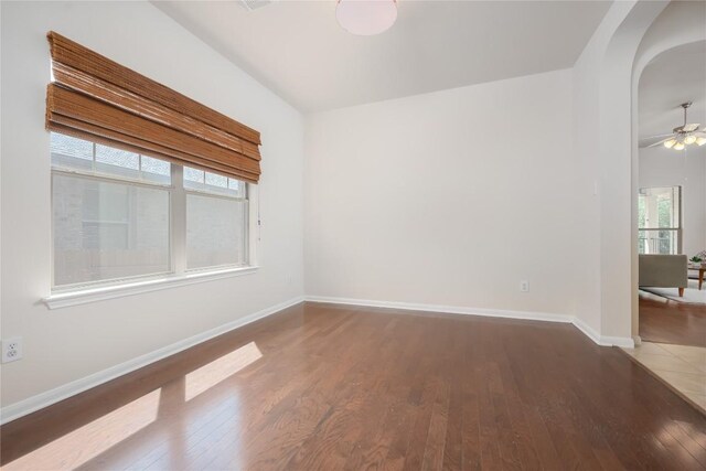 unfurnished room with ceiling fan and wood-type flooring