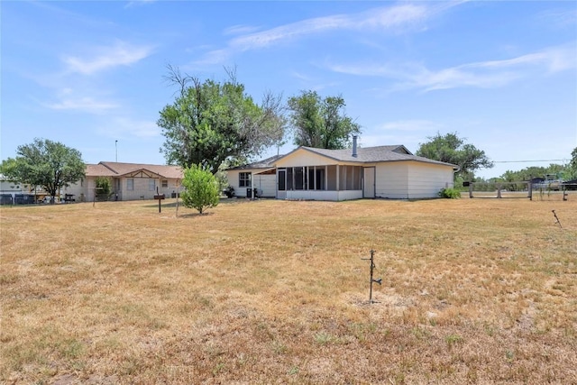 307 Golden Beach Dr, Buchanan Dam, TX 78609 - view of yard with a sunroom