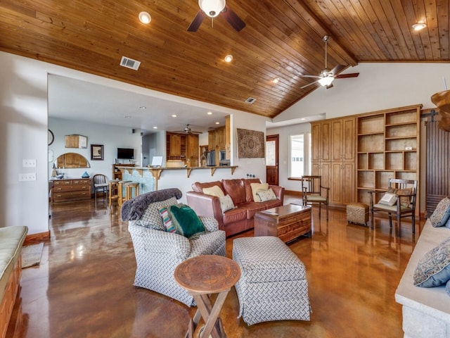 living room featuring lofted ceiling, concrete flooring, and ceiling fan