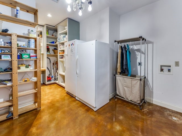 laundry area with a chandelier