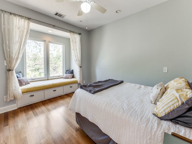 bedroom with light wood-type flooring and ceiling fan