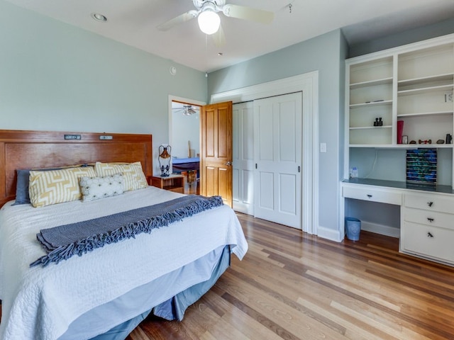 bedroom featuring light hardwood / wood-style flooring, ceiling fan, and a closet