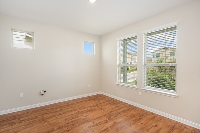 spare room featuring hardwood / wood-style flooring